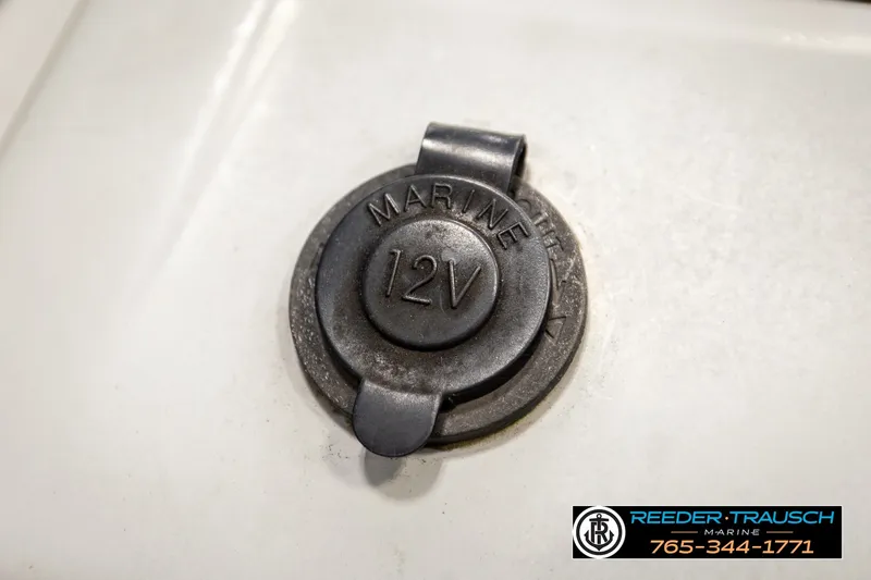 Slide: The Image of 12V marine power outlet on a 2021 Bennington SVSR boat. - 34