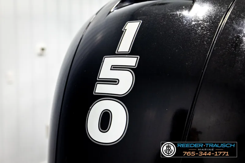 Slide: The Image of Close-up of a 2021 Bennington SVSR boat engine with "150" decal. - 49