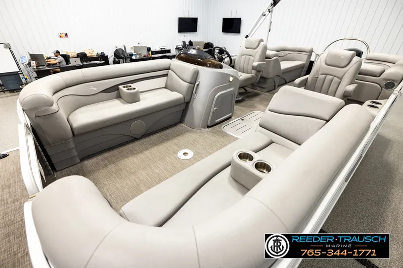 Slide: The Image of Luxurious interior of a 2021 Bennington SVSR pontoon boat with plush seating and cup holders. - 10