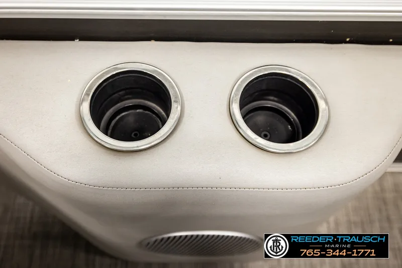 Slide: The Image of Cup holders on a 2021 Bennington SVSR boat, featuring Reeder-Trausch Marine branding. - 45