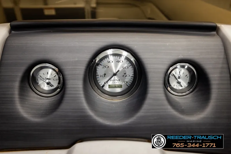 Slide: The Image of Dashboard of a 2021 Bennington SVSR boat with RPM, trim, and fuel gauges. - 36