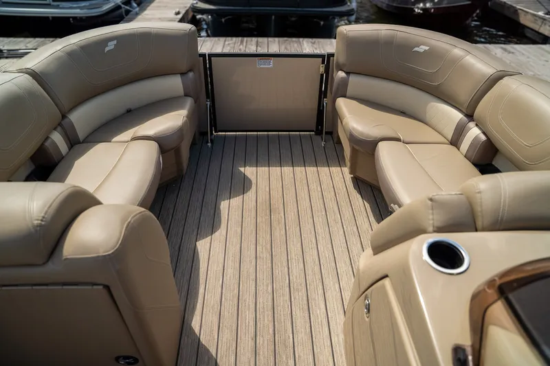 Slide: The Image of The image shows the interior of a 2021 Starcraft CX 21 R with beige leather seating. - 7
