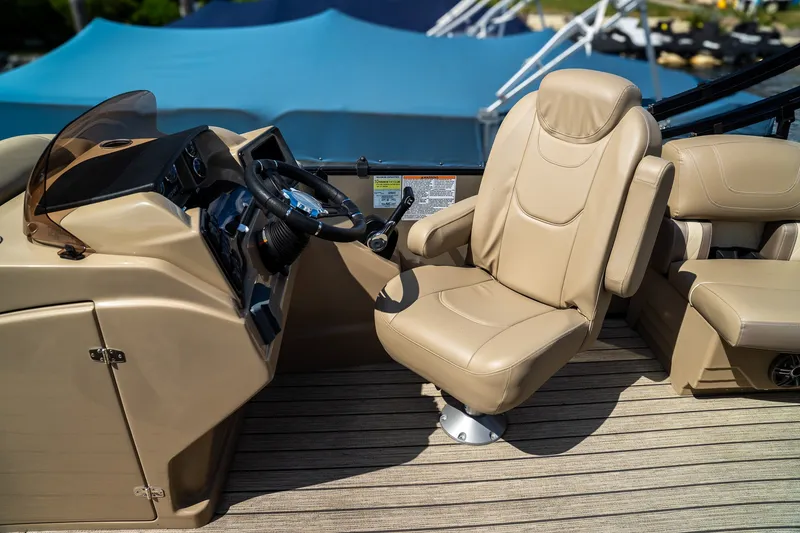 Slide: The Image of The image shows the helm of a 2021 Starcraft CX 21 R with a beige captain's chair. - 9