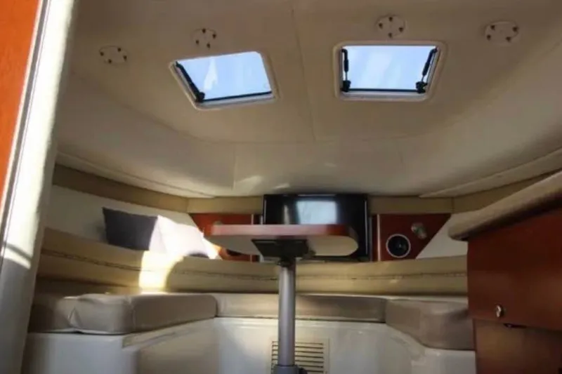 Slide: The Image of Interior of 2006 Pro-Line 32 Express boat with seating and skylights. - 7