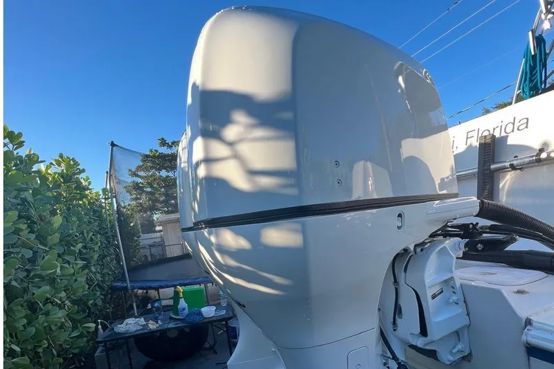 Slide: The Image of 2007 Pro-Line 32 Express boat engine, sunny day, outdoor setting, Florida location. - 1