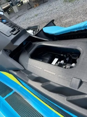 Slide: The Image of A 2023 Yamaha EX WaveRunner with an open storage compartment and blue seating area. - 4