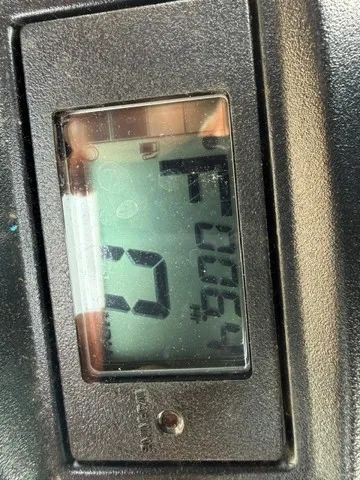 Slide: The Image of Close-up of a digital display showing numbers and letters. - 5