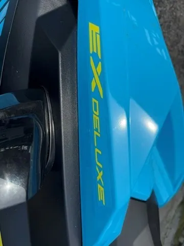 Slide: The Image of Close-up of a blue Yamaha EX WaveRunner with yellow "EX Deluxe" lettering. - 6