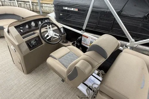 Slide: The Image of 2024 Bennington 22LSR boat interior with steering console and seating. - 5