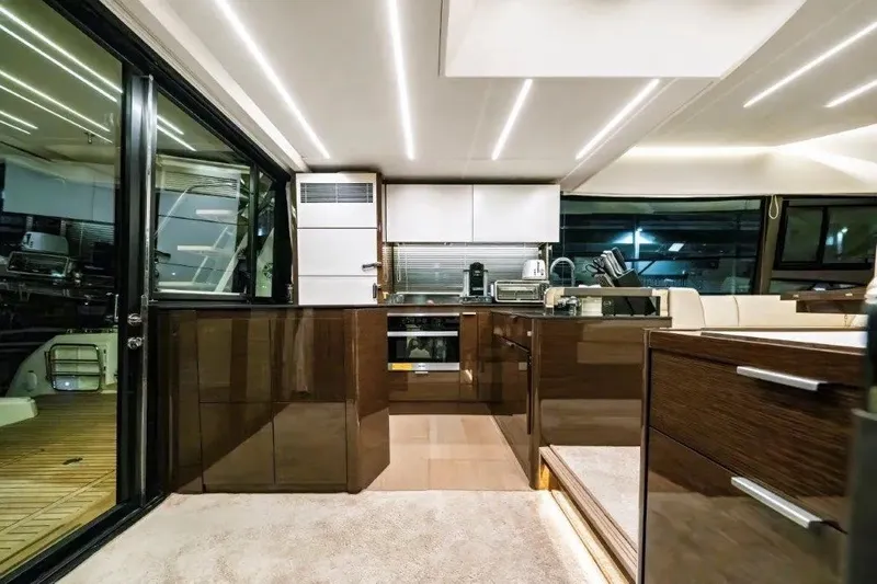 Slide: The Image of Luxurious interior of a 2020 Prestige 590 yacht with modern kitchen design. - 32