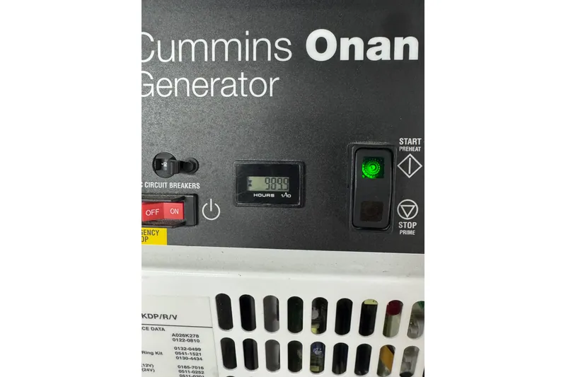 Slide: The Image of Cummins Onan generator control panel with hour meter reading 999.9 hours. - 48