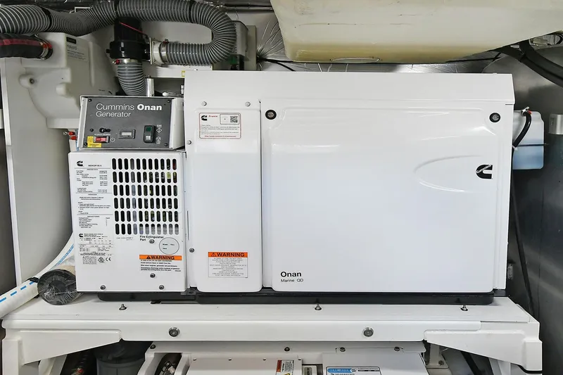 Slide: The Image of Cummins Onan generator in a 2020 Prestige 590 yacht engine room. - 47