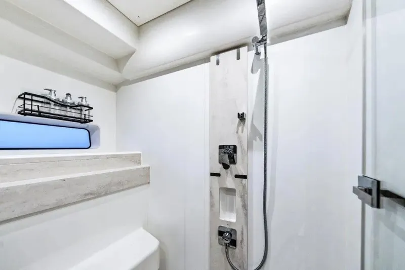 Slide: The Image of Modern shower area in 2020 Prestige 590 yacht, featuring sleek fixtures and storage. - 20