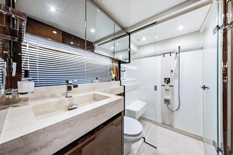Slide: The Image of Luxurious bathroom in 2020 Prestige 590 yacht with modern fixtures and glass shower. - 19