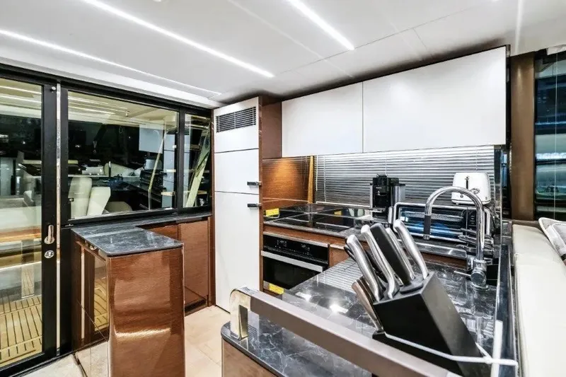 Slide: The Image of Luxurious kitchen interior of 2020 Prestige 590 yacht with modern appliances and sleek design. - 33