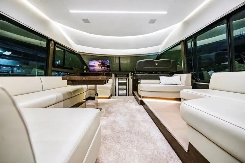 Slide: The Image of Luxurious interior of 2020 Prestige 590 yacht with modern seating and ambient lighting. - 34