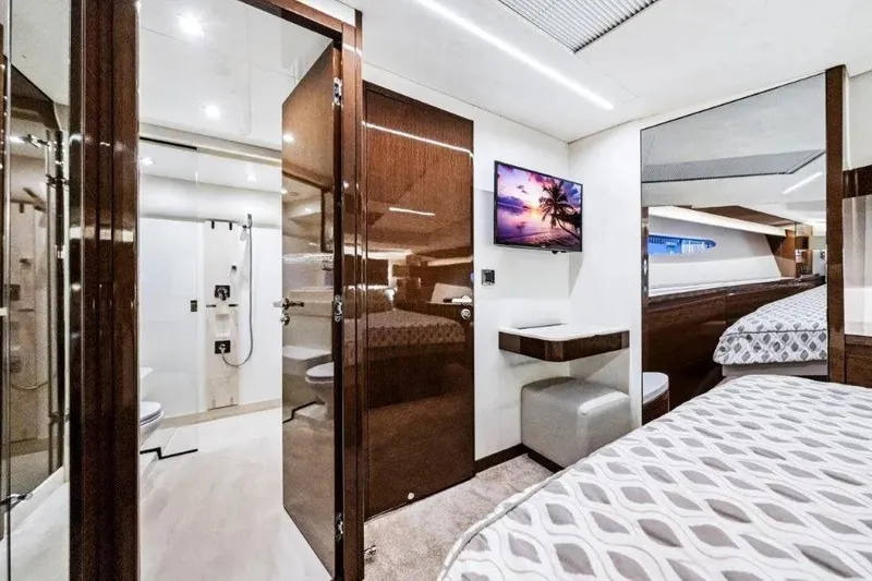 Slide: The Image of Luxurious interior of 2020 Prestige 590 yacht with modern bedroom and bathroom. - 15