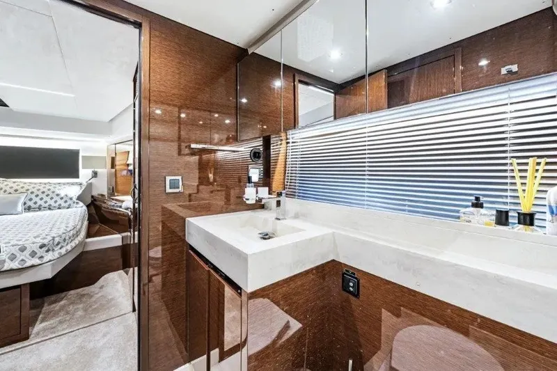 Slide: The Image of Luxurious interior of 2020 Prestige 590 yacht featuring elegant bathroom and cozy bedroom. - 18