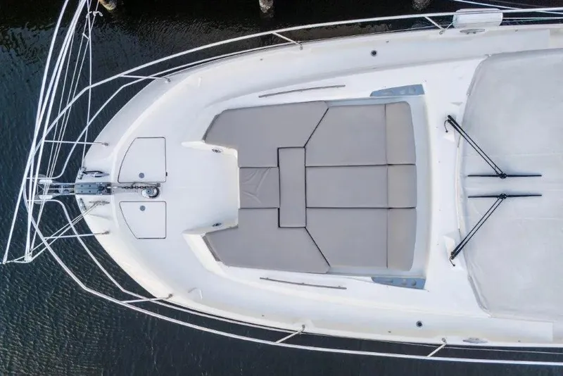 Slide: The Image of Aerial view of 2020 Prestige 590 yacht's spacious deck with cushioned seating. - 3