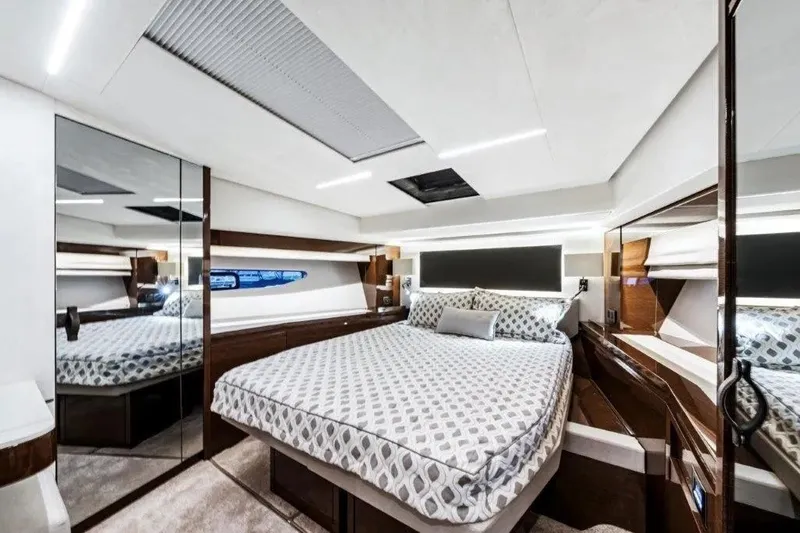 Slide: The Image of Luxurious bedroom interior of 2020 Prestige 590 yacht with modern design and elegant furnishings. - 24