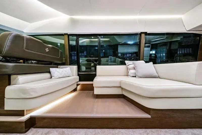 Slide: The Image of Luxurious interior of 2020 Prestige 590 yacht with elegant seating and ambient lighting. - 36