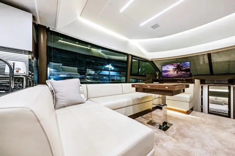 Slide: The Image of Luxurious interior of 2020 Prestige 590 yacht with modern seating and elegant decor. - 35
