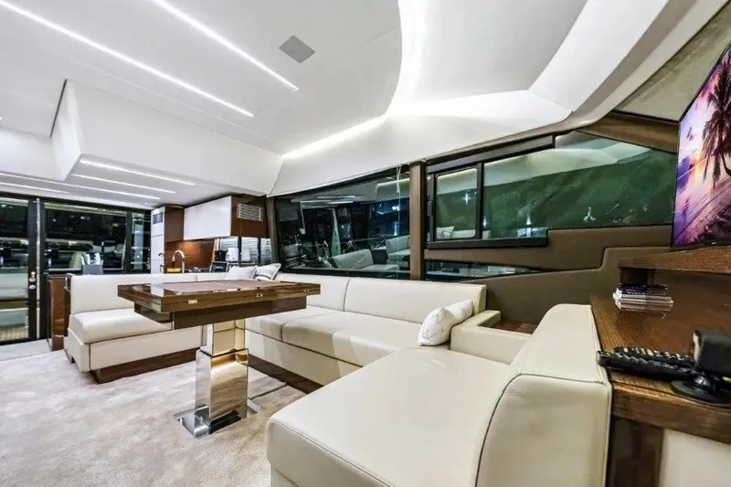 Slide: The Image of Luxurious interior of a 2020 Prestige 590 yacht with modern furnishings and ambient lighting. - 29