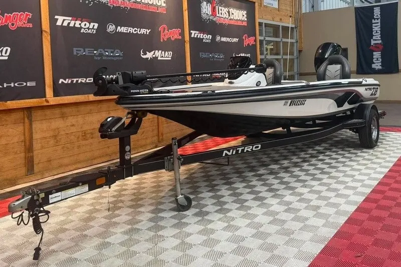 Slide: The Image of 2017 Nitro Z18 boat on display in showroom with branded backdrop. - 3