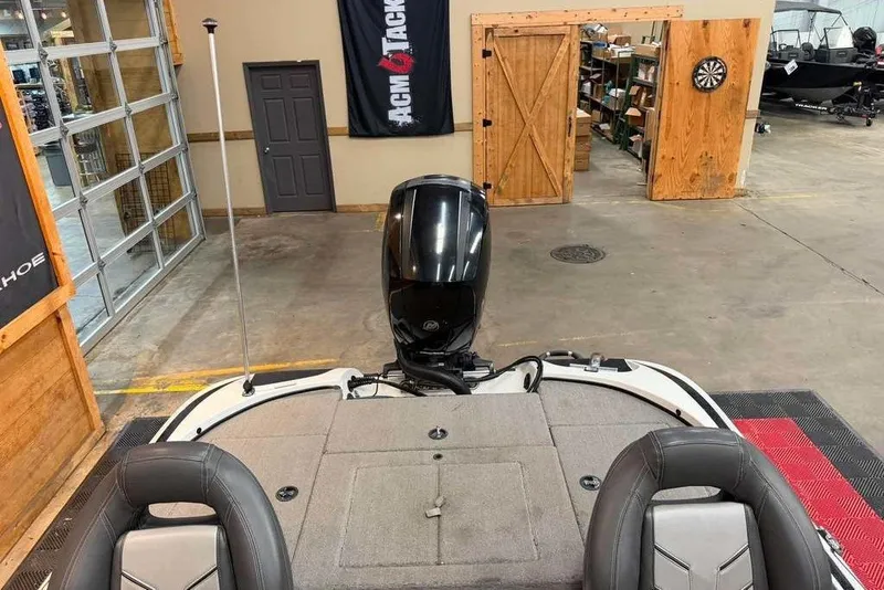 Slide: The Image of 2017 Nitro Z18 boat interior in showroom with motor and seating visible. - 6