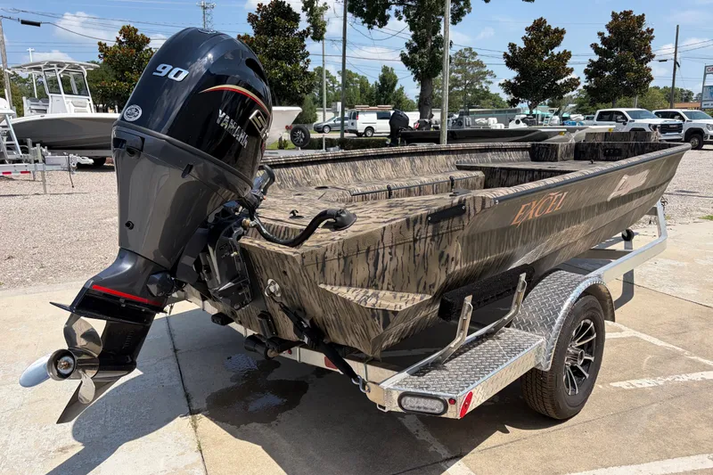 Slide: The Image of 2026 Excel 183 Tomahawk boat on trailer with Yamaha 90 outboard motor. - 4