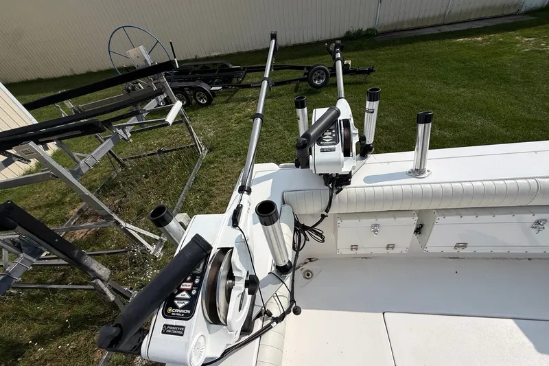 Slide: The Image of 2006 Baha Cruiser 299 SF boat deck with fishing rod holders and equipment. - 5