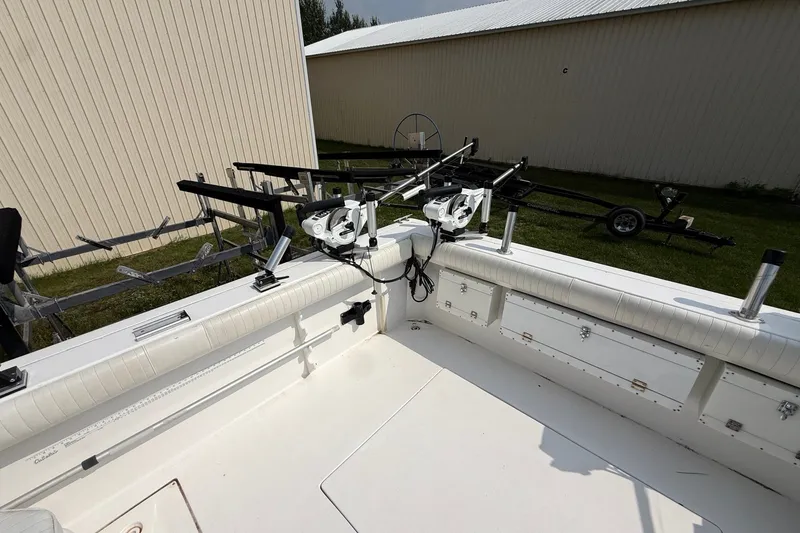 Slide: The Image of 2006 Baha Cruiser 299 SF boat interior with fishing rod holders and storage compartments. - 4