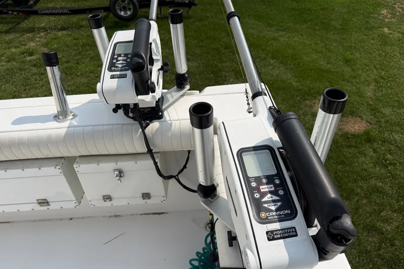Slide: The Image of Fishing equipment on a 2006 Baha Cruiser 299 SF boat, featuring rod holders and controls. - 7