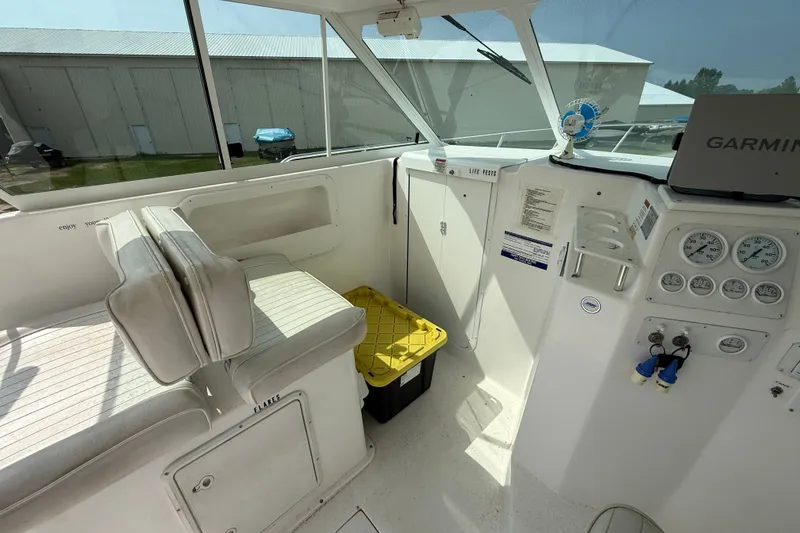Slide: The Image of Interior of 2006 Baha Cruiser 299 SF boat with seating and control panel. - 12