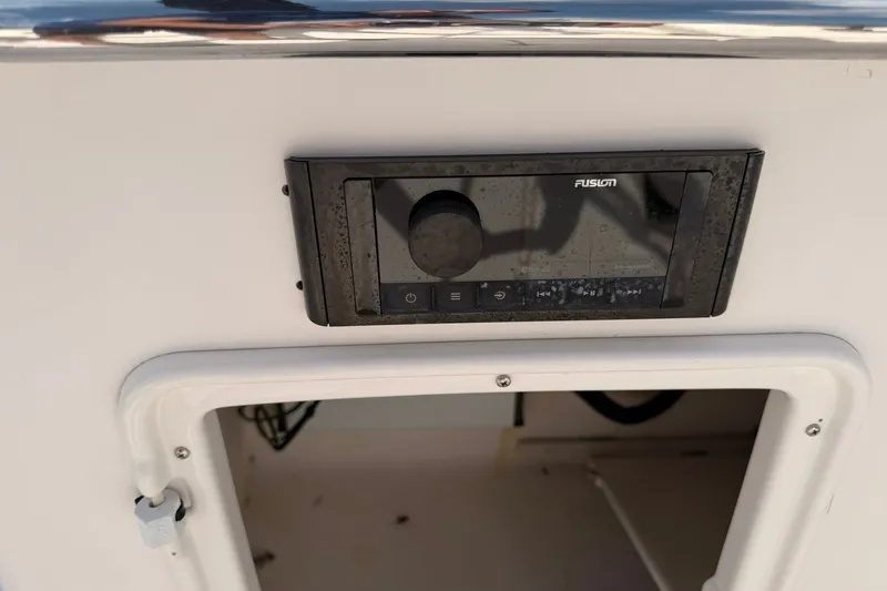 Slide: The Image of Fusion stereo system on a 2007 Regal 2700 Bowrider boat dashboard. - 18