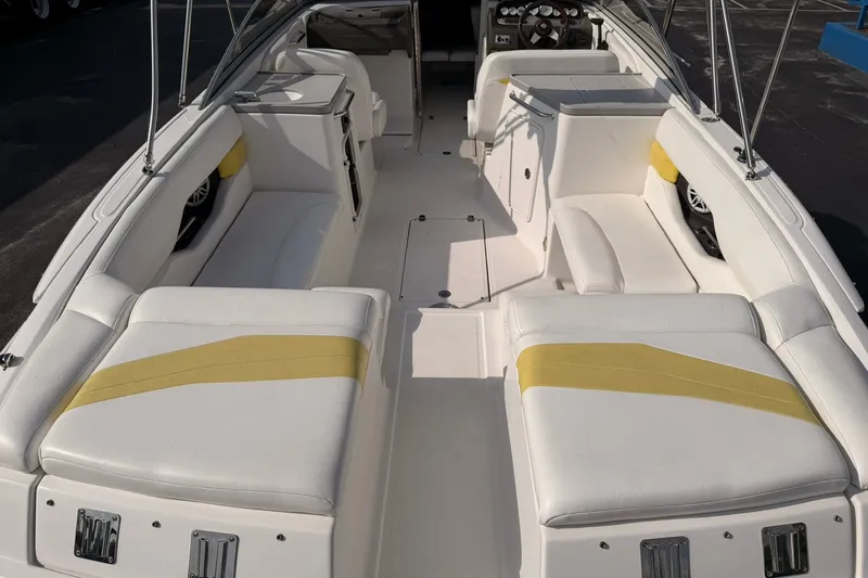 Slide: The Image of 2007 Regal 2700 Bowrider boat interior with white and yellow seating. - 9
