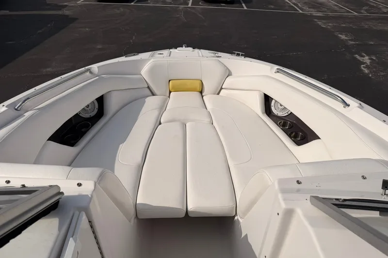 Slide: The Image of 2007 Regal 2700 Bowrider boat interior with white seating and cup holders. - 20