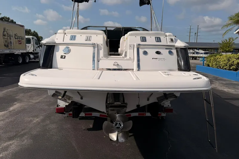 Slide: The Image of 2007 Regal 2700 Bowrider boat rear view with swim platform and propeller. - 7