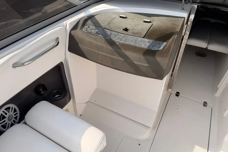 Slide: The Image of Interior view of a 2007 Regal 2700 Bowrider boat, featuring seating and storage compartments. - 12