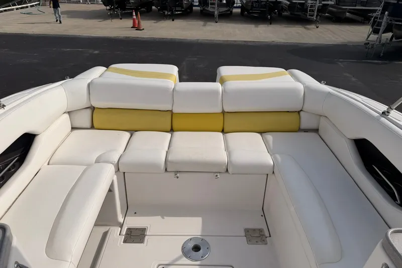 Slide: The Image of 2007 Regal 2700 Bowrider boat interior with white and yellow seating. - 19