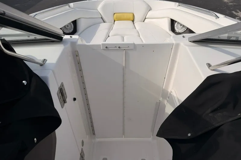 Slide: The Image of 2007 Regal 2700 Bowrider interior with white seating and open windshield. - 21