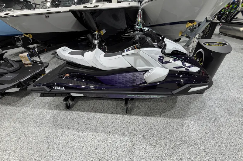 The Image of 2026 Yamaha WaveRunner VX Cruiser HO in showroom, sleek design, white and purple accents. - 1
