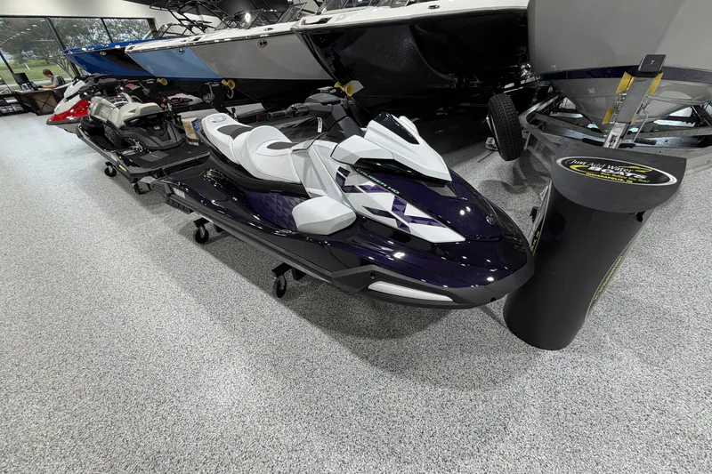 Slide: The Image of 2026 Yamaha WaveRunner VX Cruiser HO displayed in a showroom with other watercraft. - 2