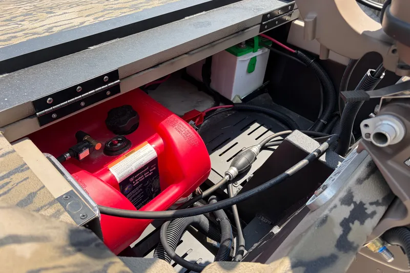 Slide: The Image of Interior view of 2026 Excel 1651 River Warrior boat showing fuel tank and battery. - 12