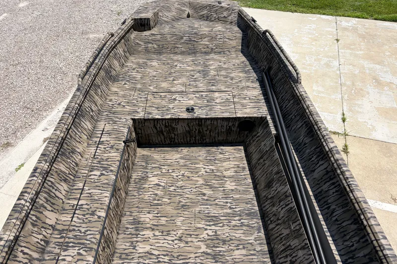 Slide: The Image of 2026 Excel 1651 River Warrior boat with camouflage pattern, viewed from above. - 9