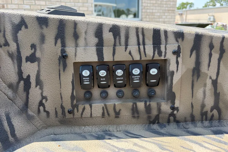 Slide: The Image of Control panel of 2026 Excel 1651 River Warrior boat with camouflage design. - 11