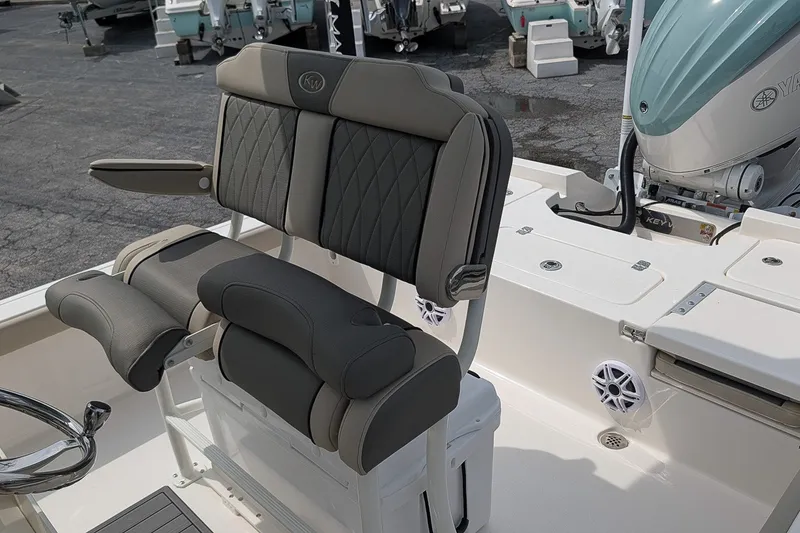 Slide: The Image of 2027 Key West 250 Bay Reef boat interior with cushioned seating and Yamaha engine. - 16