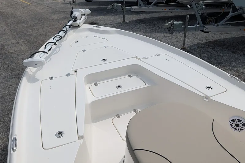 Slide: The Image of 2027 Key West 250 Bay Reef boat deck with storage compartments and trolling motor. - 22