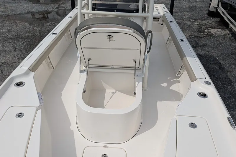 Slide: The Image of 2027 Key West 250 Bay Reef boat interior with open storage compartment. - 21
