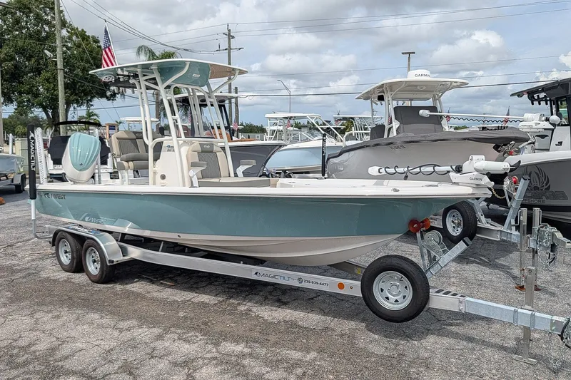 The Image of 2027 Key West 250 Bay Reef boat on trailer in outdoor showroom. - 0
